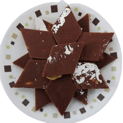 Anjeer Katli pieces with whole figs and almonds visible at the edge