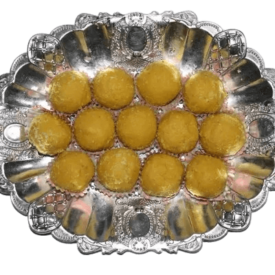 Soft Besan Laddu rounds laid out for the gift box