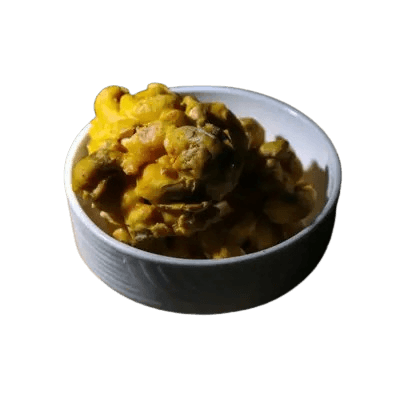 Cashew mithai stacked on a brass plate